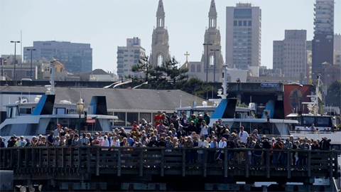 FILE - Spectators at Pier 39 watch an America's Cup sailing event in San Francisco, Sept. 18, 2013. The FBI said Dec. 22, 2017, that it had found a martyrdom letter and several guns in the home of a former Marine who may have been planning a Christmas Day attack on a popular San Francisco tourist destination (AP)