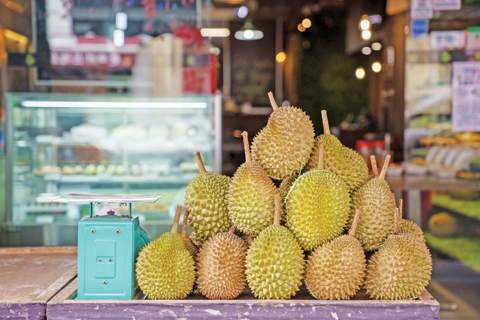 Durian fruit outside Mao Shan Wang cafe in the Chinatown district of Singapore