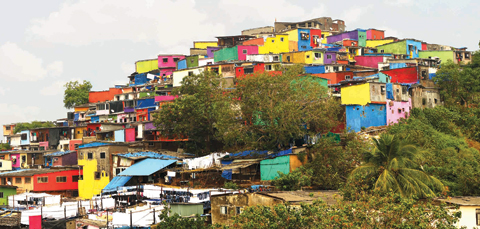 A slum in Asalpha, in Mumbai’s eastern suburbs, got a colorful makeover through a charity initiative aimed at brightening slums, home to more than half the city’s population. — Photos by Chal Rang De
