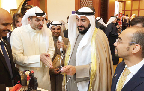 KUWAIT: CEO of Central Circle Co Dr Ziad Al-Alyan (second left) discusses the latest ear, nose and throat technologies with Health Minister Sheikh Dr Basel Al-Sabah (second right) at an ENT conference. n
