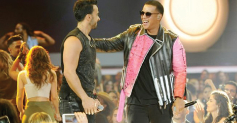 Daddy Yankee (right), pictured in this April 27, 2017 file photo with Luis Fonsi, attributes the hip-shaking popularity of his latest song “Dura” to “the magic of music”. — AFP
