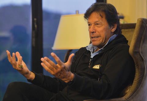 ISLAMABAD: Pakistani cricketer-turned-opposition leader and head of the Pakistan Tehreek-i-Insaf (PTI), Imran Khan speaks during an interview at his home in Islamabad. —AFP