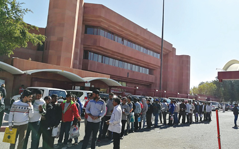 KUWAIT: People lined up outside the Indian Embassy’s building yesterday. —Photo by Ben Garcia