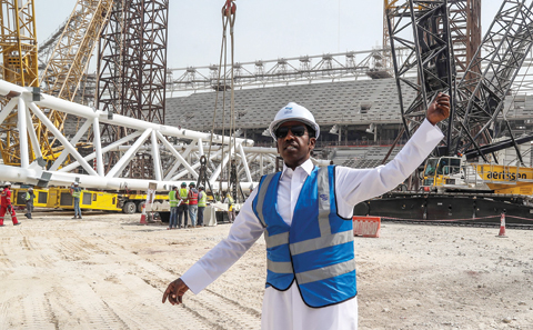 DOHA: Qatar’s Thani Al-Zarraa, project Manager of Al-Wakrah Stadium, a World Cup venue designed by celebrated Iraqi-British architect Zaha Hadid, directs workers at the site yesterday. — AFP