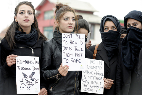 KASHMIR: Kashmiri law students hold placards during a protest calling for justice following the rape and murder of an eight-year-old girl in the Indian state of Jammu yesterday. —AFP