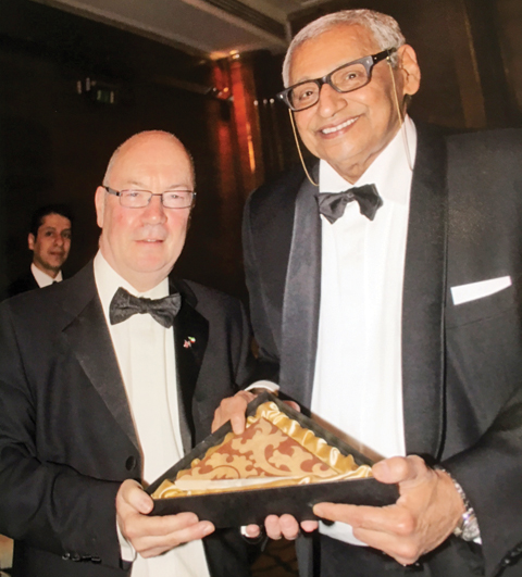 LONDON: British Minister of State for the Middle East and North Africa Affairs Alistair Burt (left) honors Kuwaiti Ambassador to United Kingdom and Northern Ireland Khaled Al-Duwaisan. — KUNA
