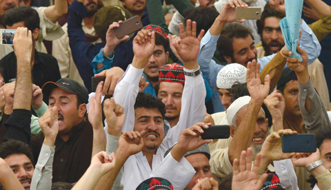 PESHAWAR: Pakistani demonstrators from the tribal Pashtun Protection Movement (PPM) shout slogans during a rally in Peshawar. —AFP