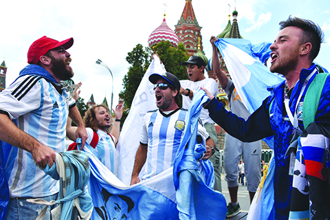 MOSCOW: Argentina's national football team fans cheer outside the Kremlin in Moscow yesterday, ahead of the Russia 2018 World Cup football tournament. – AFP
