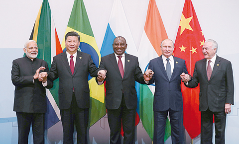JOHANNESBURG: (Left to right) India’s Prime Minister Narendra Modi, China’s President Xi Jinping, South Africa’s President Cyril Ramaphosa, Russia’s President Vladimir Putin and Brazil’s President Michel Temer pose for a group picture during the 10th BRICS summit at the Sandton Convention Centre in Johannesburg, South Africa. —AFP