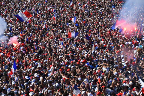 People cheer as they watch the 2018 World Cup final football match between France and Croatia in Montpellier in southern France yesterday. - AFP n