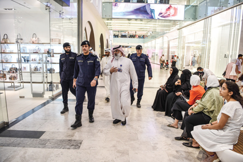 KUWAIT: Police tour a mall as part of a plan to maintain security during the summer.