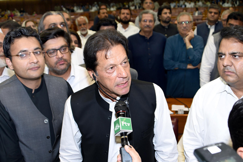 ISLAMABAD: In this handout photograph released by the National Assembly (NA) on August 17, 2018, Pakistan’s newly appointed Prime Minister Imran Khan (C) addresses the lawmakers after been elected by National Assembly. — AFP