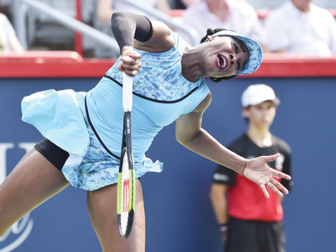 MONTREAL: Venus Williams serves against Caroline Dolehide during day one of the Rogers Cup at IGA Stadium on August 6, 2018. - AFP