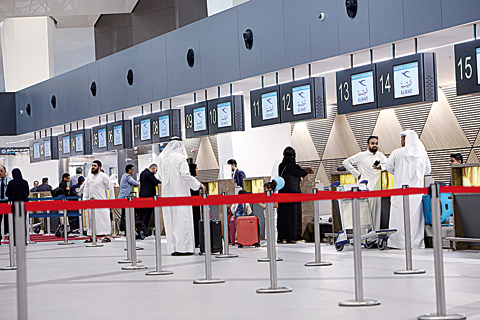 Passengers and staff busy on the opening day of the new T4 passenger terminal. — Photos by Yasser Al-Zayyat