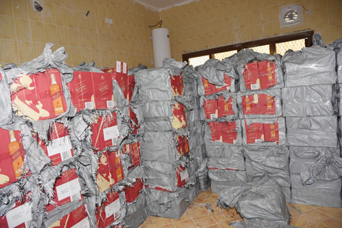 KUWAIT: Cardboard boxes containing liquor bottles found in a Jaber Al-Ahmad house yesterday