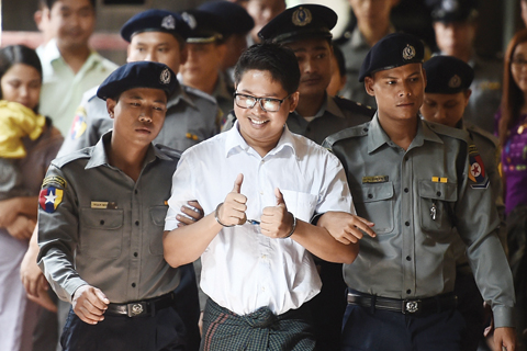 YANGON: Reuters journalist Wa Lone (C) arrives in court in Yangon on September 3, 2018 to face verdict after months of trial since he was detained on December 12, 2017. — AFP