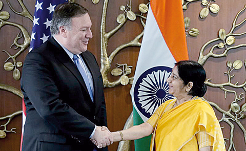nNEW DELHI: US Secretary of State Mike Pompeo shakes hands with India's Foreign Minister Sushma Swaraj before the start of their meeting in New Delhi.--Reutersnnn