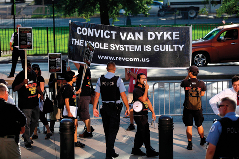 CHICAGO: Demonstrators march outside the Leighton Criminal Courthouse Building for the first day of Chicago police officer Jason Van Dyke murder trial in Chicago, Illinois. — AFP