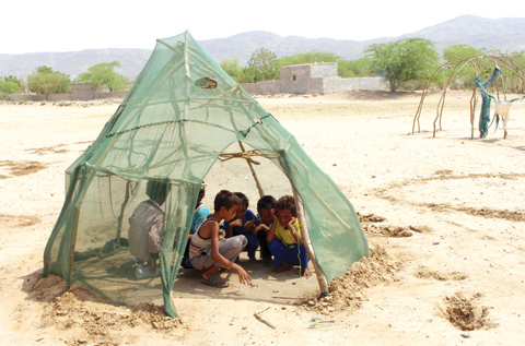 AL HAJJAH, Yemen: Displaced Yemeni children from Hodeida play in a shelter at a make-shift camp in a village in the northern district of Abs in Hajjah province. — AFP