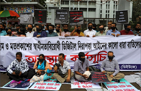 Journalists hold banners and placards as they protest against the newly passed Digital Security Act in front of the Press Club in Dhaka, Bangladesh, October 11, 2018. REUTERS