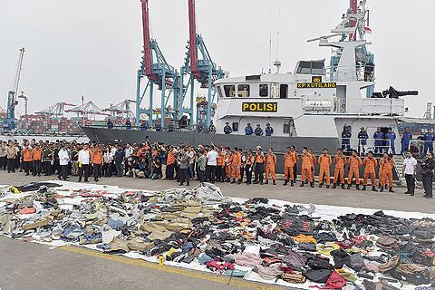 JAKARTA: Recovered debris from the ill-fated Lion Air flight JT 610 are laid out as Indonesia’s President Joko Widodo visits the search and rescue operations centre at a port in northern Jakarta yesterday. —AFP