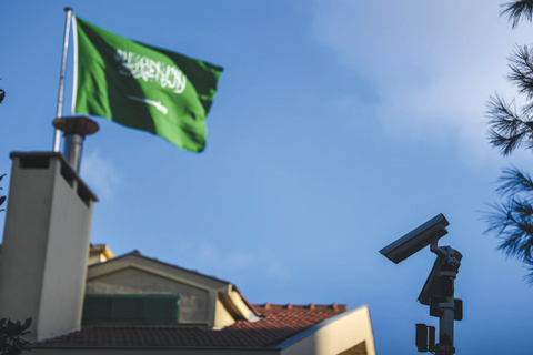 ISTANBUL: A Saudi Arabian flag flies over as CCTV camera is seen at the Saudi Arabian consulate in Istanbul yesterday. — AFP