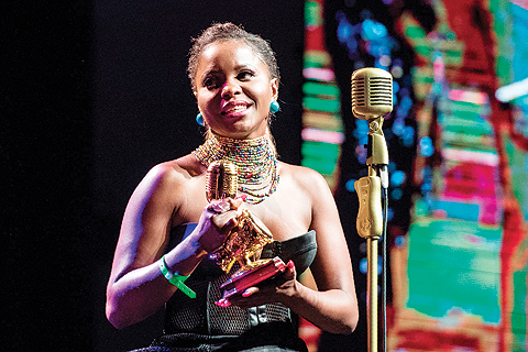 Recipient of the Best Female Central Africa artist Cameroonian singer Daphne accepts her award onstage during the All Africa Music Awards (AFRIMA) at the Accra Conference Centre.-AFP photos