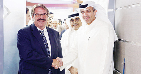 Harald Wolf, General Manager, Middle East Management Centre, Roche (left), and Dr Ziad Al-Alyan, CEO of Central Circle Company shake hands at the inauguration ceremony
