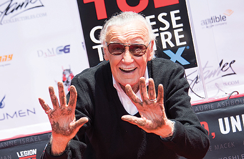 In this file photo taken on July 18, 2017 Comic-book writer, editor, and publisher Stan Lee places his hands in cement during his hand and footprint ceremony at TCL Chinese Theatre IMAX, in Hollywood, California. — AFP photos
