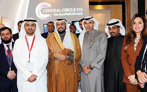KUWAIT: President of the conference Dr Mutlaq Al-Sihan, Health Minister Sheikh Dr Basel Al- Sabah and CEO of Central Circle Co Dr Ziad Al-Alyan pose for a group photo with Central Circle Co staff. — Photos by Joseph Shagra
