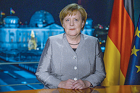 (ATTENTION: EMBARGOED FOR PUBLICATION UNTIL DECEMBER 30, 2018 23:00 GMT) - German Chancellor Angela Merkel poses for a photograph after the recording of her annual New Year's speech at the Chancellery in Berlin on December 30, 2018. (Photo by John MACDOUGALL / POOL / AFP) / ATTENTION: EMBARGOED FOR PUBLICATION UNTIL DECEMBER 30, 2018 23:00 GMT