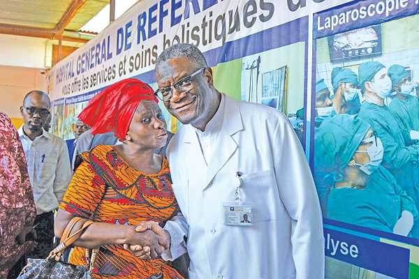 BUKAVU: In this file photo taken on October 6, 2018, Nobel Peace Prize winner Denis Mukwege (R) poses for a photograph at the Panzi hospital in Bukavu, in the Democratic Republic of the Congo's South Kivu province, a day after it was announced that he will receive the prestigious award. - AFP  n