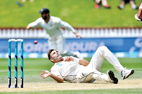 WELLINGTON: New Zealand's Tim Southee falls as he bowls during day four of the first Test cricket match between New Zealand and Sri Lanka at the Basin Reserve in Wellington yesterday. - AFP