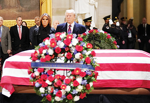 WASHINGTON:  US President Donald Trump and First Lady Melania Trump arrive to pay their respects to former US President George HW Bush as he lies in state in the US Capitol's rotunda on Monday. - AFP 