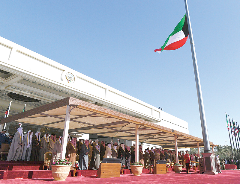 KUWAIT: The Kuwaiti flag is raised during a ceremony held at Bayan Palace yesterday. — Amiri Diwan photos