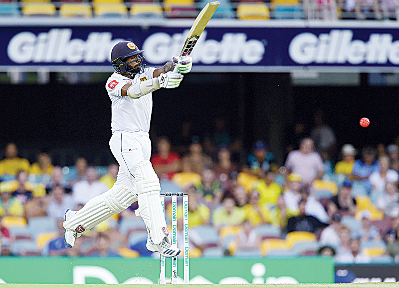 BRISBANE: Sri Lanka's Niroshan Dickwella plays a shot during the first day of the day-night Test cricket match between Australia and Sri Lanka at the Gabba in Brisbane yesterday. - AFPn
