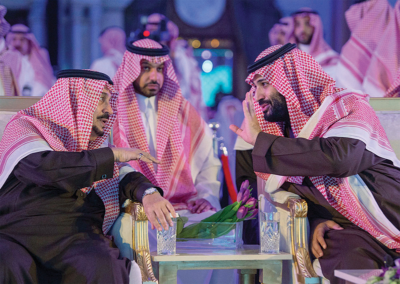 RIYADH: A handout picture provided by the Saudi Press Agency (SPA) on Jan 28, 2019 shows Crown Prince Mohammed bin Salman (right) speaking to King Salman during a ceremony at the Ritz Carlton hotel. —AFP