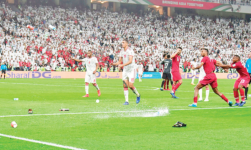 ABU DHABI: Emirati fans throw bottles and footwear at Qatari players during the 2019 AFC Asian Cup semifinal match between Qatar and UAE at the Mohammed bin Zayed Stadium on Tuesday. - AFP 