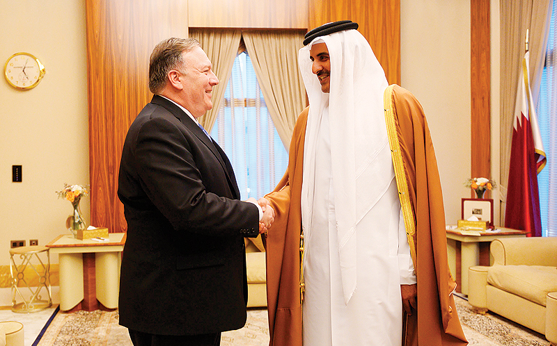DOHA: US Secretary of State Mike Pompeo meets Amir of Qatar Tamim bin Hamad Al- Thani at the Sea Palace yesterday. — AFP