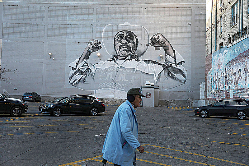 EL PASO, TEXAS: A man walks past a mural. —AFP