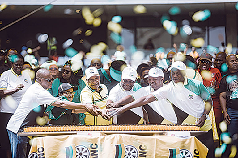 African National Congress (ANC) Secretary General Ace Magashule, Deputy Secretary Jessie Duarte, former President Jacob Zuma, South African President Cyril Ramaphosa and Deputy President David Mabuza and Treasurer General Paul Mashatile toast during the African National Congress' (ANC) 107th anniversary celebrations at the Moses Mabhida Stadium in Durban on January 12, 2019. - The new head of the ruling ANC and President Cyril Ramaphosa,pledged in tackling unemployment, poverty and inequality. South Africans go to the polls in May 2019. (Photo by Rajesh JANTILAL / AFP)