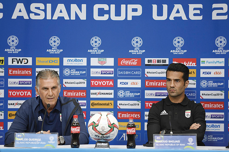 ABU DHABI: Iran’s coach Carlos Queiroz (L) and Iran’s Masoud Shojaei (R) attend a pre-match press conference on the eve of their AFC Asian Cup match against China at Mohammed Bin Zayed Stadium in Abu Dhabi yesterday. — AFP