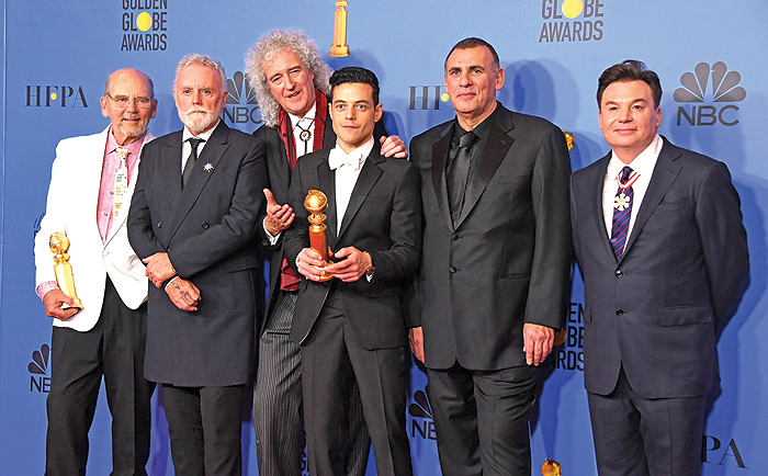 Best Actor in a Motion Picture - Drama for ‘Bohemian Rhapsody’ winner Rami Malek poses with Graham King (second right), Brian May (third left) and Mike Myers (right) in the press room during the 76th annual Golden Globe Awards on January 6, 2019, at the Beverly Hilton hotel in Beverly Hills, California. — AFP