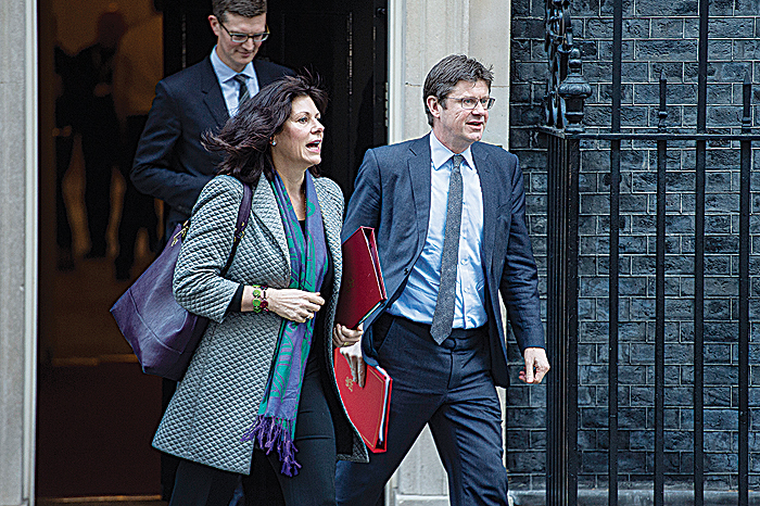 LONDON: Britain’s Minister of State at the Department for Business, Energy and Industrial Strategy Claire Perry (L) and Britain’s Business Secretary Greg Clark (R) leave after attending the weekly meeting of the cabinet at 10 Downing Street. —AFP
