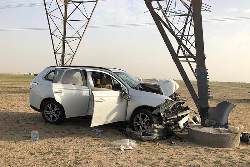 A vehicle that collided into a high-voltage pylon is seen