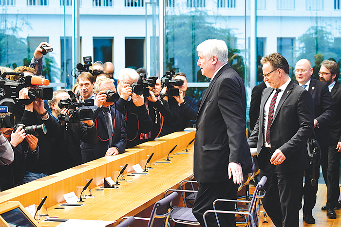 BERLIN: (LtoR) German Interior Minister Horst Seehofer, the President of the German Federal Criminal Police Office (BKA) Holger Muench and the President of the German Federal Office for Information Security Arne Schoenbohm arrive to give a press conference a few days after private datas from hundreds of politicians including German Chancellor have been published online. — AFP