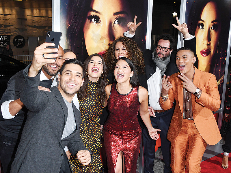 Wilmer Valderrama (second left) takes a selfie with America Ferrera (third left), Gina Rodriguez (fourth left) and Ismael Cruz Cordova (right) upon arriving for the premiere of Columbia Pictures “Miss Bala” at Regal LA Live Stadium 14 in Los Angeles, California. — AFP