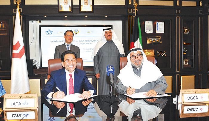 KUWAIT: DGCA’s Director General Yousef Al-Fawzan (right) and IATA’s Vice President for Africa and the Middle East Mohammed Al-Bakri sign the agreement. — KUNA