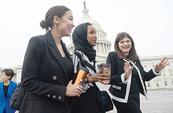 WASHINGTON DC: US Representative Alexandria Ocasio-Cortez, Democrat of New York; US Representative Ilhan Omar (C), Democrat of Minnesota; and US Representative Haley Stevens (R), Democrat of Michigan, arrive for a photo opportunity with the female House Democratic members of the 116th Congress outside the US Capitol. —AFP