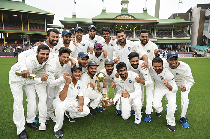 SYDNEY: India's team pose with the Border-Gavaskar trophy as they celebrate their series win on the fifth day of the fourth and final cricket Test against Australia at the Sydney Cricket Ground in Sydney yesterday. – AFPn